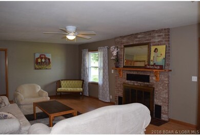 Living Room features beautiful brick fireplace!