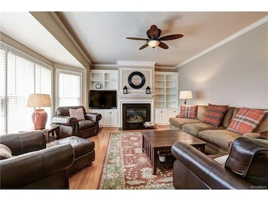 Family room with gas fireplace and built ins.