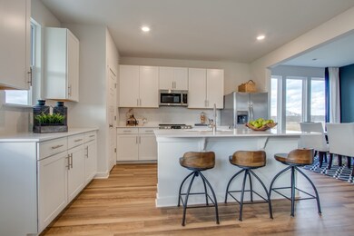 Quartz countertops and subway tile backsplash included *Photos of model home, same floor plan. Features/finishes vary. See onsite agent for details