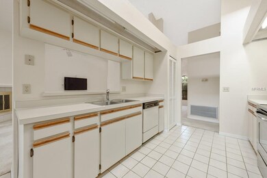 **KITCHEN with plenty of cabinets and counter space overlooks LIVING ROOM**