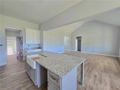 Layout view- access to the garage, utility room and half bath off the kitchen.