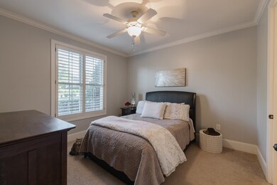 Guest Suite - Set in the front of the house, away from the Master and upstairs Secondary bedrooms, for your guests' privacy.  Walk-in closet, plantation blindes, en suite bathroom.