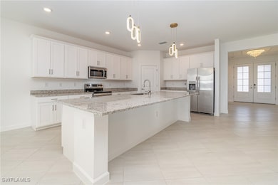 Kitchen featuring appliances with stainless steel