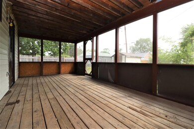 Screened porch off the back