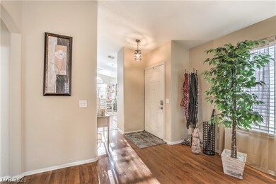 The entry to the home is open and inviting. A neut