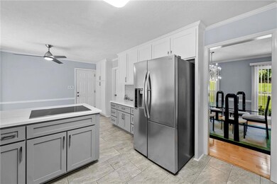 Newly updated kitchen with new appliances, flooring, cabinets, backsplash  and counters