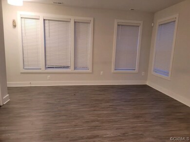 Unfurnished room with dark hardwood / wood-style flooring