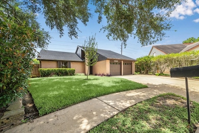 Receive a warm welcome home with mature trees, a l