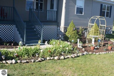 The approach to the house features a beautifully l