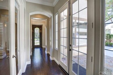 Wrought iron door and luxurious foyer to greet you