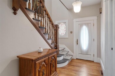 2-Story entry level foyer with stunning wooden railing