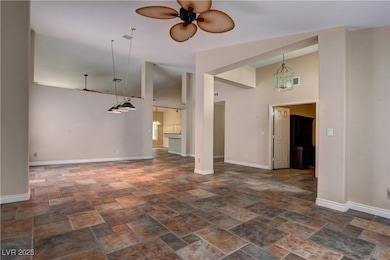 Unfurnished living room with stone tile floors, a