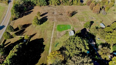 Overview of rural landscape featuring a tree filled landscape