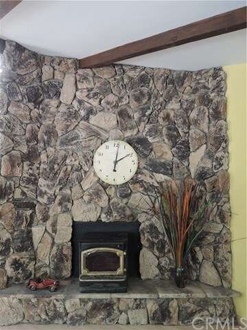 Rock wall fireplace with fireplace insert for thos