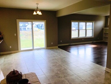 View from front hallway of kitchen dining area and