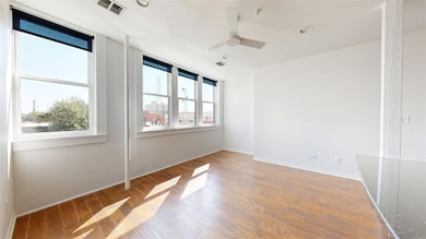Unfurnished room featuring a ceiling fan, a wealth