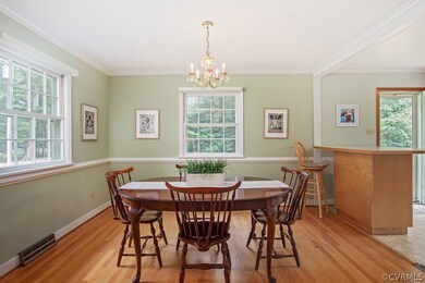 Dining Room with chair and crown molding, chandeli