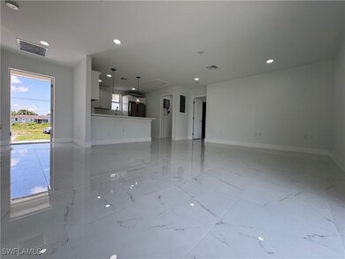 Unfurnished living room with recessed lighting and