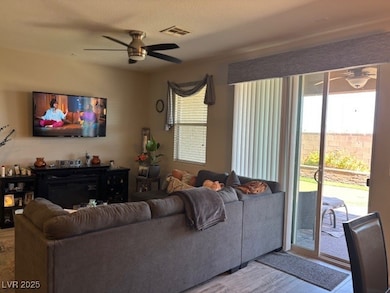 Living area featuring a ceiling fan