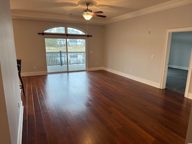 Spare room with dark wood-type flooring, ceiling f