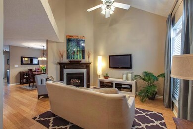 New Bamboo floors are in all living areas...living room is very open and bright...fireplace surround has custom distressed paint finish.
