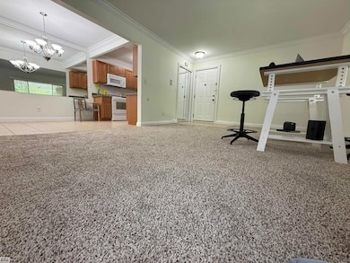 shows foyer, open dining area & layout
