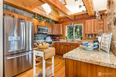 Beautiful kitchen with skylight and gorgeous exposed wood beams.