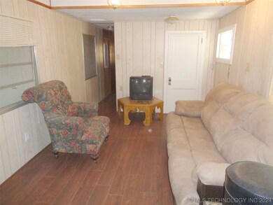 Hallway leads to bedroom and full bath