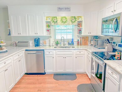 Kitchen featuring light hardwood / wood-style floo
