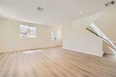 Unfurnished living room with light wood-type floor
