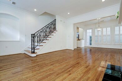 Enter this home into a foyer with designer railing
