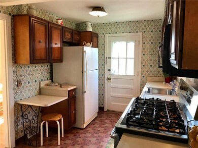 Kitchen has exterior entrance from the side