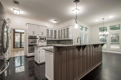 Kitchen cabinets recently painted Oct 2023.  Double convection ovens, built in microwave, two islands, breakfast bar, and refrigerator conveys.