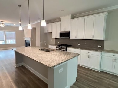 Kitchen with stainless steel appliances, a ceiling