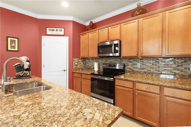 Kitchen featuring ornamental molding, a sink, ligh