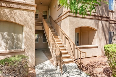 Property entrance featuring stucco siding