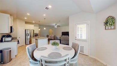 Dining room featuring ceiling fan and recessed lig