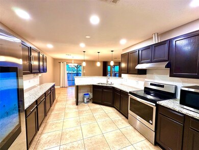 Kitchen featuring appliances with stainless steel