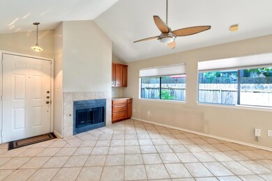 Unfurnished living room featuring a tile fireplac
