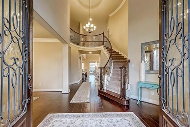 Two-story entry and wood floors throughout the main areas.