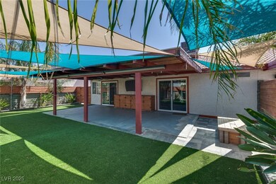 Back of house featuring a fenced backyard, ceiling