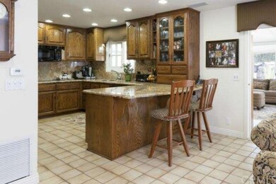 Kitchen is perfectly located, open to the family r