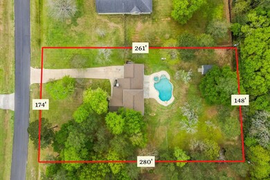 This lot runs 174' across the front, over 260' down the sides, and 148' along the tree-lined back. No rear human neighbors...just deer!