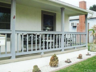 This is a covered front porch with fiber board rai