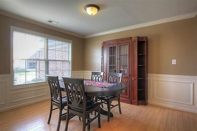 Dining Room with wainscoting, laminate f