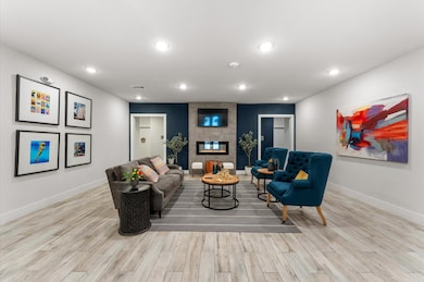 Photo showcases a modern entryway with a cozy atmo