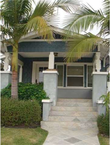 Front of home, through the white picket fence