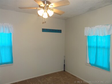 Bedroom #1 has carpet, fan & closet.