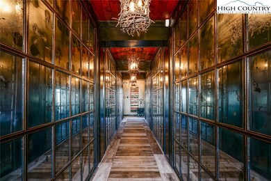 The dreamy foyer lined with antique mirrors