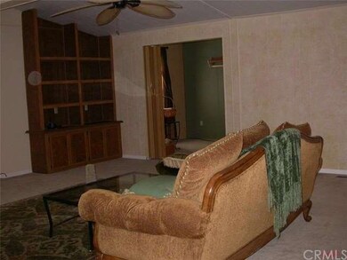 Large open living room with built in bookcase.  Se